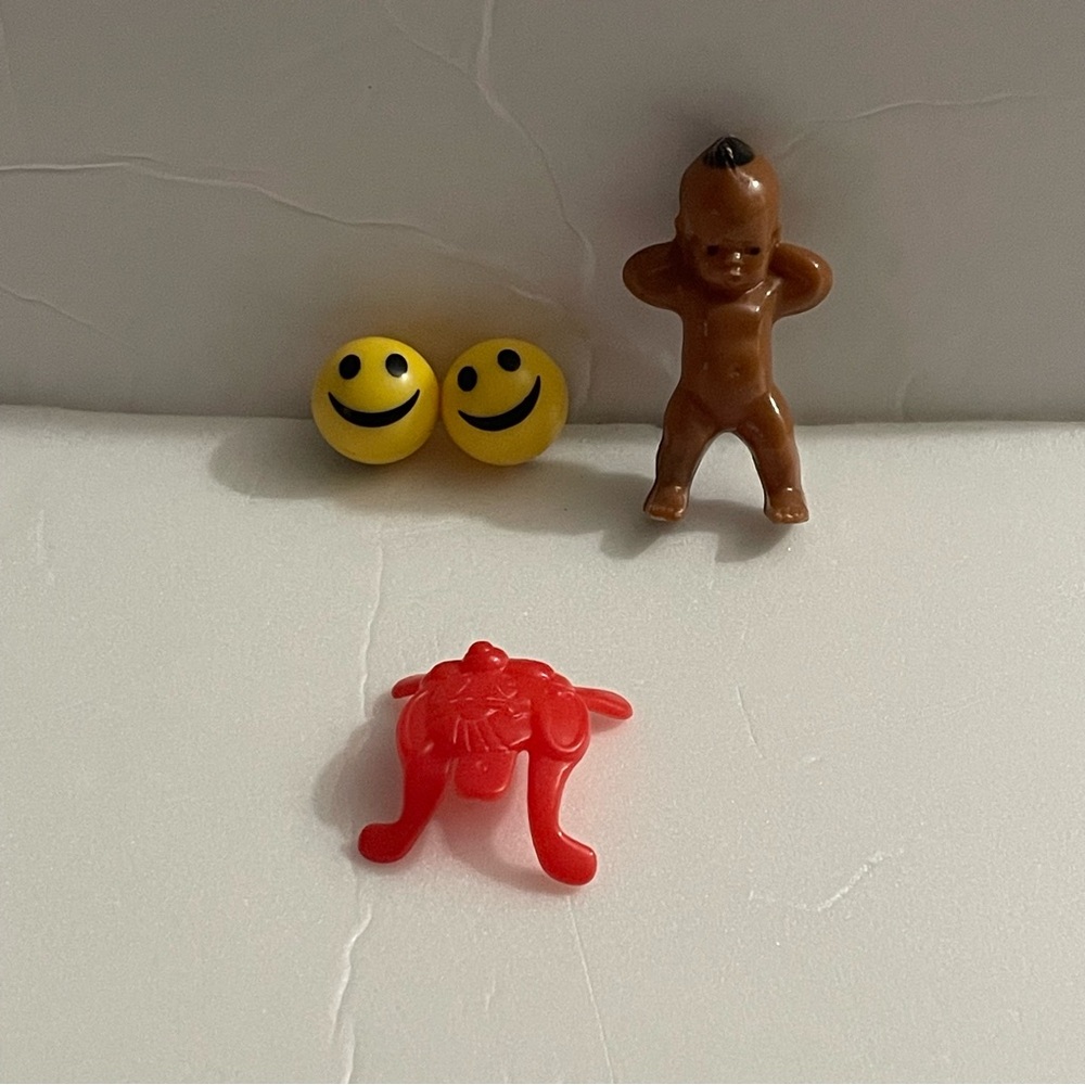 Toy Bundle of Emoji Balls, Native American Baby Doll, and Chuck E Cheese’s Toy